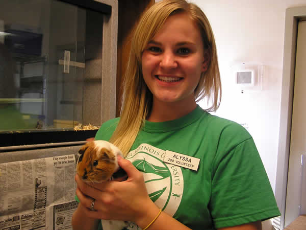 teenager holding a guinea