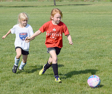 girls playing soccer